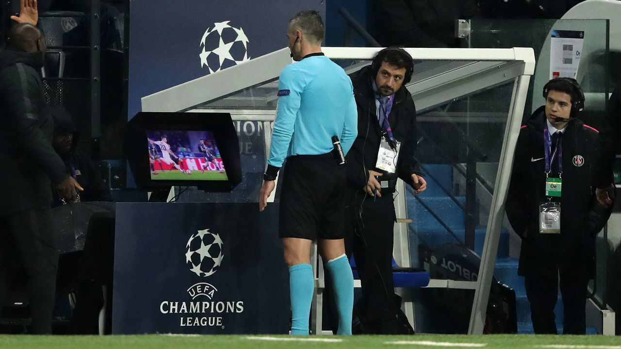 Match referee Damir Skomina studies the VAR System prior to awarding Manchester United a penalty during the UEFA Champions League match at the Parc des Princes, Paris, France.