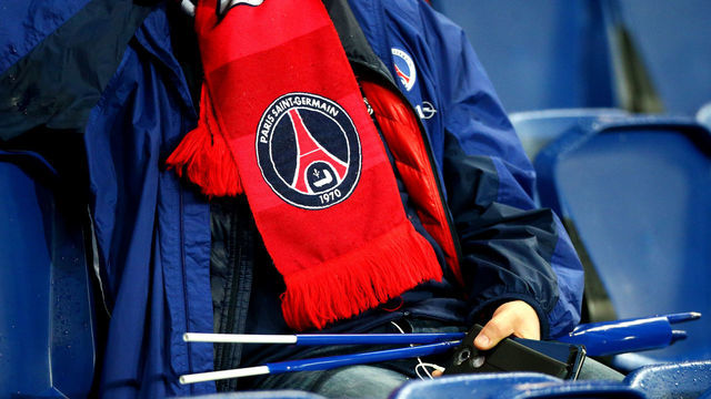 PARIS,FRANCE - MARCH 6: A Paris Saint Germain scarf worn by a fan during the UEFA Champions League Round of 16 Second Leg match between Paris Saint-Germain and Manchester United at Parc des Princes on March 6, 2019 in Paris, .