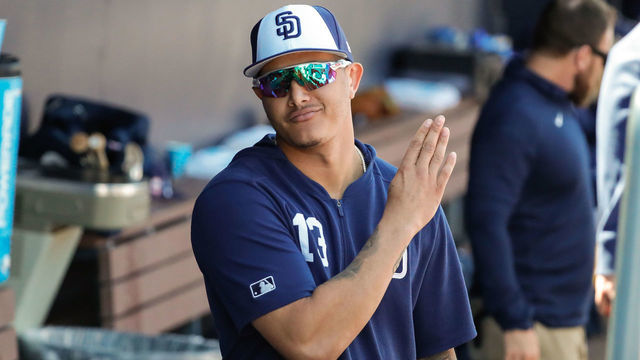 PEORIA, AZ - FEBRUARY 27: San Diego Padres infielder Manny Machado (13) looks on from the dugout during the MLB spring training baseball game between the Arizona Diamondbacks and the San Diego Padres on February 27, 2019 at Peoria Sports Complex Stadium in Peoria, Arizona.