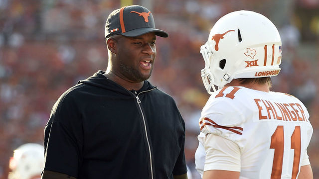 LOS ANGELES, CA - SEPTEMBER 16: Former Texas player Vince Young talks with Texas (11) Sam Ehlinger (QB) during a college football game between the Texas Longhorns and the USC Trojans on September 16, 2017 at the Los Angeles Memorial Coliseum in Los Angeles, CA .
