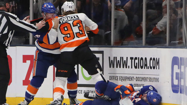 UNIONDALE, NEW YORK - MARCH 09: Josh Bailey #12 of the New York Islanders goes after Jakub Voracek #93 of the Philadelphia Flyers after his third period hit on Johnny Boychuk #55 of the New York Islanders at NYCB Live's Nassau Coliseum on March 09, 2019 in Uniondale, New York. The Flyers defeated the Islanders 5-2.