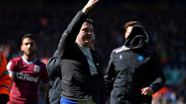 BIRMINGHAM, ENGLAND - MARCH 10: A fan is escorted off the pitch after striking Jack Grealish of Aston Villa during the Sky Bet Championship match between Birmingham City and Aston Villa at St Andrew's Trillion Trophy Stadium on March 10, 2019 in Birmingham, England.