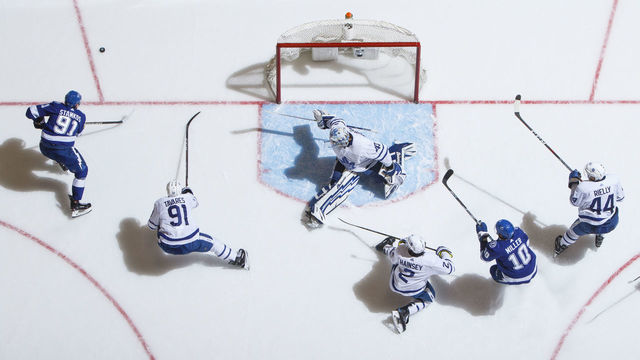 TORONTO, ON - MARCH 11: Steven Stamkos #91 of the Tampa Bay Lightning and John Tavares #91 of the Toronto Maple Leafs battle for the puck as Ron Hainsey #2, Morgan Rielly #44 and Garret Sparks #40 defend against J.T. Miller #10 during the second period at the Scotiabank Arena on March 11, 2019 in Toronto, Ontario, Canada.