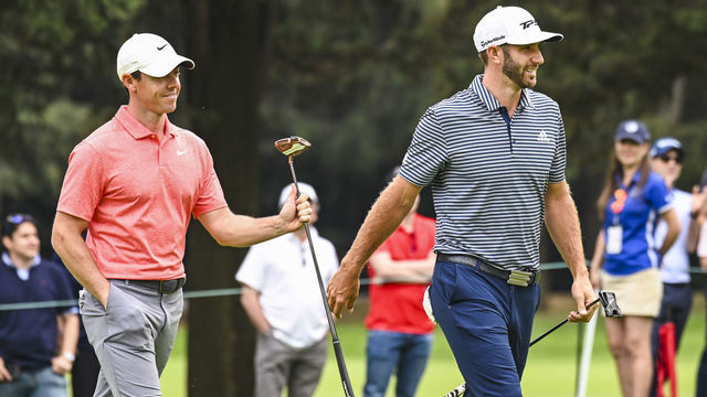 MEXICO CITY, MEX - FEBRUARY 24: Dustin Johnson and Rory McIlroy of Northern Ireland smile after McIlroy almost made an eagle putt on the 15th hole green during the final round of the World Golf Championships - Mexico Championship at Club de Golf Chapultepec on February 24, 2019 in Mexico City, Mexico.