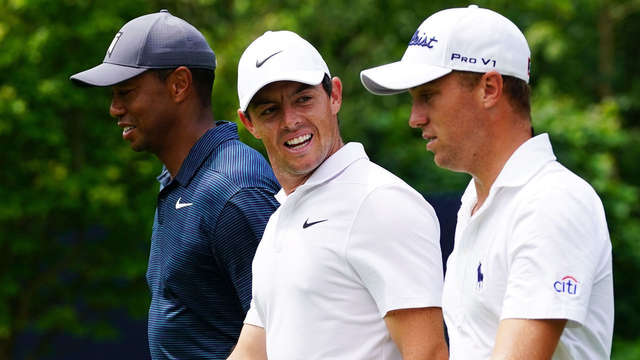 ST LOUIS, MO - AUGUST 09: (L-R) Tiger Woods of the United States, Rory McIlroy of Northern Ireland and Justin Thomas of the United States walk on the eighth hole during the first round of the 2018 PGA Championship at Bellerive Country Club on August 9, 2018 in St Louis, Missouri.