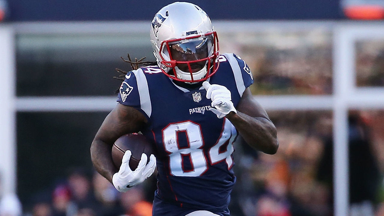 FOXBOROUGH, MA - DECEMBER 23: Cordarrelle Patterson #84 of the New England Patriots runs with the ball against Lorenzo Alexander #57 of the Buffalo Bills during the first half at Gillette Stadium on December 23, 2018 in Foxborough, Massachusetts.