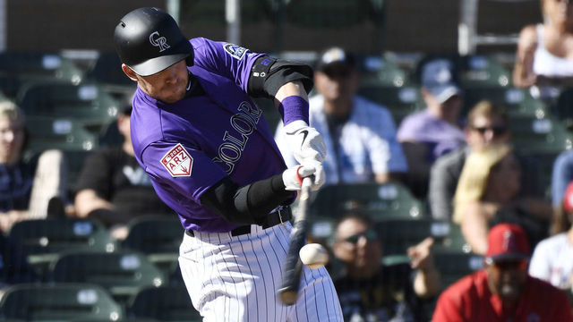 SCOTTSDALE, AZ - FEBRUARY 27: Colorado Rockies shortstop Trevor Story (27) hits a 439 ft. solo home run against the Los Angeles Angels in the 5th inning at Salt River Fields February 27, 2019.