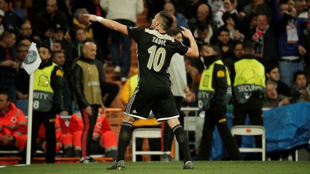 MADRID, SPAIN - MARCH 5: Dusan Tadic of Ajax celebrates after scoring a goal during UEFA Champions League Round of 16 second leg match between Real Madrid and Ajax at Santiago Bernabeu Stadium in Madrid, Spain on 5, 2019.