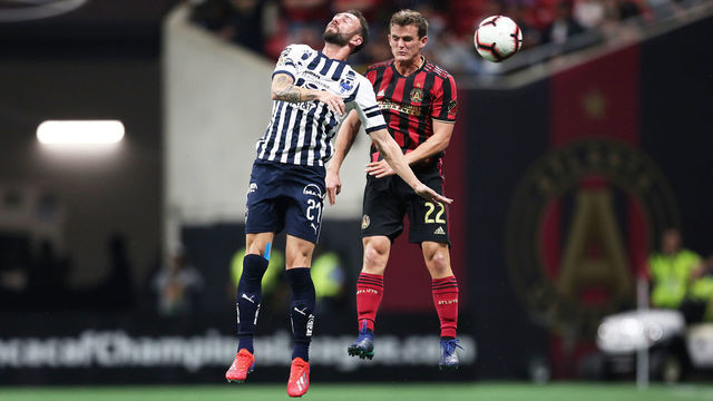 ATLANTA, GA - MARCH 13: Miguel Layun #21 of CF Monterrey and Mikey Ambrose #22 of Atlanta United fight ball the during the match between Atlanta United and Monterrey as part of the CONCACAF Champions League 2019 at Mercedes-Benz Stadium on March 13, 2019 in Atlanta, Georgia.