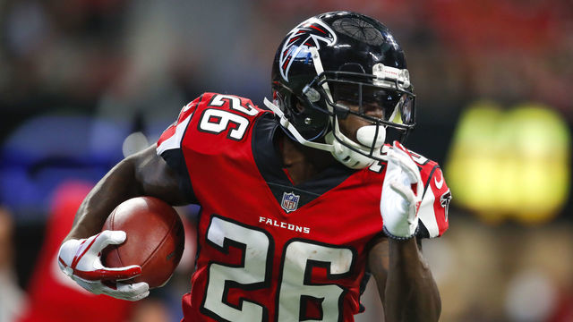ATLANTA, GA - SEPTEMBER 23: Atlanta Falcons running back Tevin Coleman (26) rushes in an NFL football game between the New Orleans Saints and Atlanta Falcons on September 23, 2018 at Mercedes-Benz Stadium.