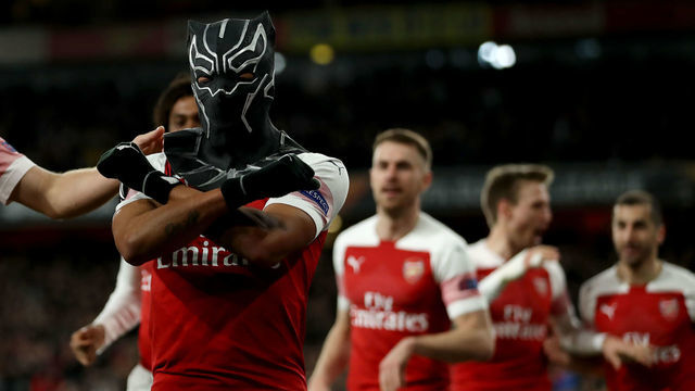 14th March 2019, Emirates Stadium, London, England; UEFA Europa League football, round of 16, second leg, Arsenal versus Rennes; Pierre-Emerick Aubameyang of Arsenal celebrates in a spiderman mask as he scores for 3-0 in the 72nd minute