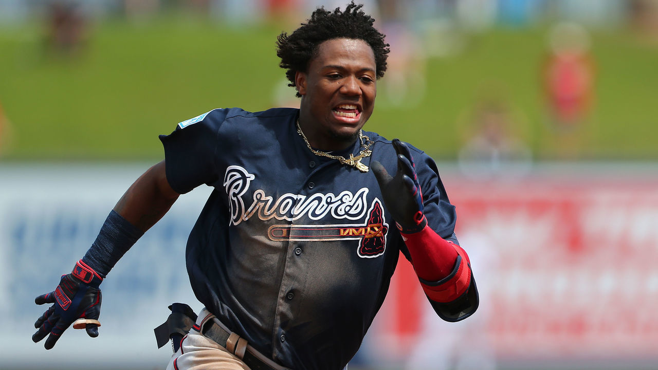 WEST PALM BEACH, FL - MARCH 13: Ronald Acuna Jr. #13 of the Atlanta Braves runs to third base for an RBI triple against the Washington Nationals during the third inning of a spring training baseball game at Fitteam Ballpark of the Palm Beaches on March 13, 2019 in West Palm Beach, Florida. The Nationals defeated the Braves 8-4.