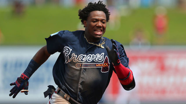 WEST PALM BEACH, FL - MARCH 13: Ronald Acuna Jr. #13 of the Atlanta Braves runs to third base for an RBI triple against the Washington Nationals during the third inning of a spring training baseball game at Fitteam Ballpark of the Palm Beaches on March 13, 2019 in West Palm Beach, Florida. The Nationals defeated the Braves 8-4.