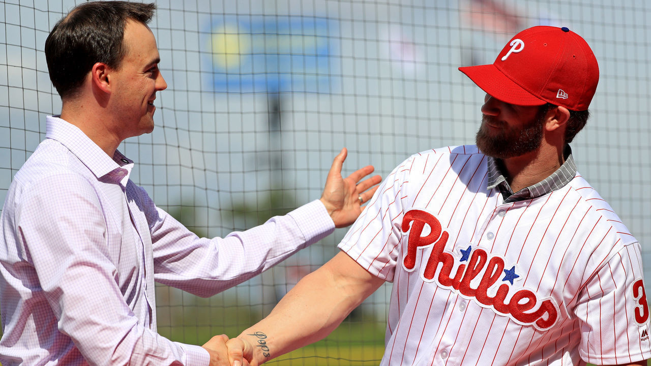 CLEARWATER, FLORIDA - MARCH 02: Bryce Harper is introduced to the Philadelphia Phillies by General Manager Matt Klentak during a press conference at Spectrum Stadium on March 02, 2019 in Clearwater, Florida.