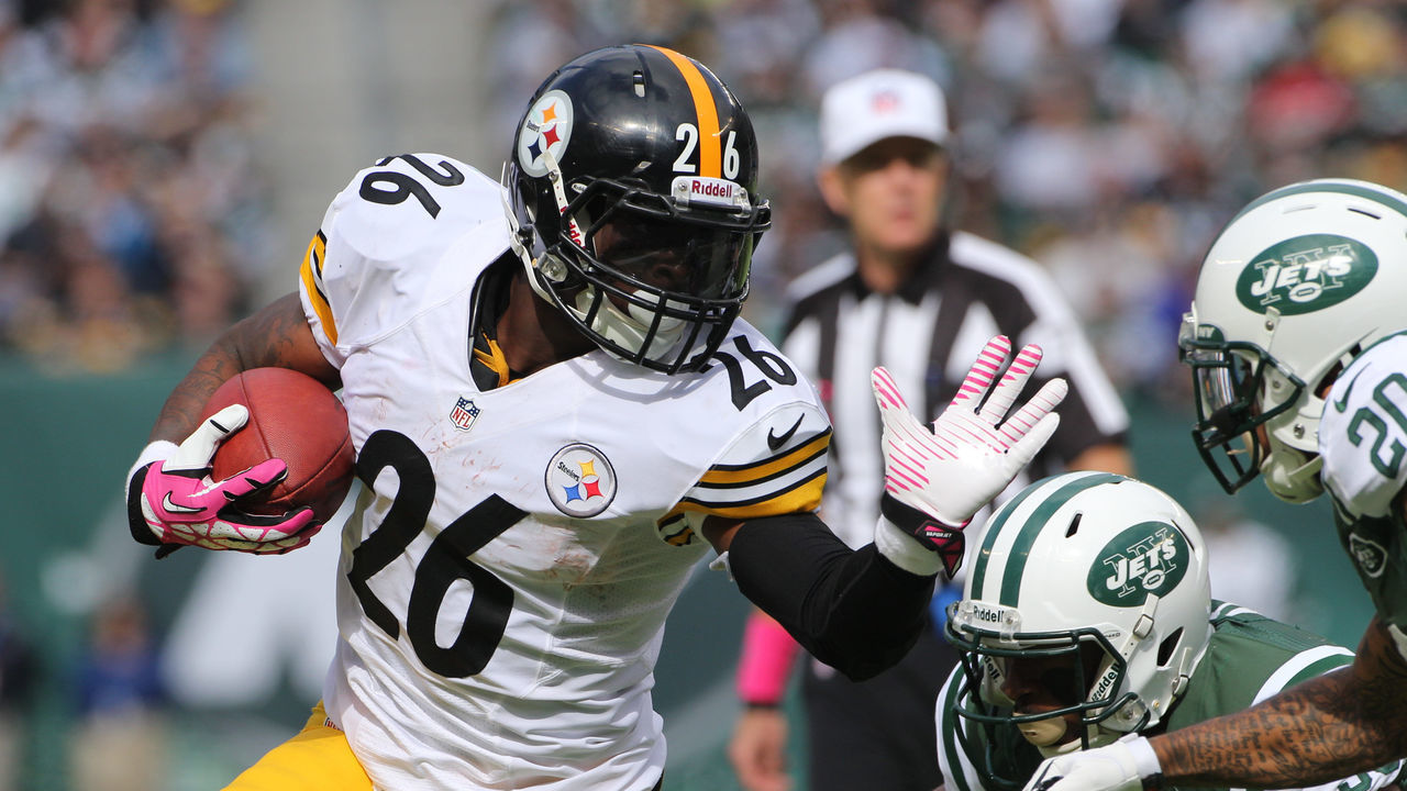 Le'Veon Bell, Pittsburgh Steelers is tackled by Kyle Wilson, New York Jets, during the New York Jets V Pittsburgh Steelers NFL regular season game at MetLife Stadium, East Rutherford, NJ, USA. 13th October 2013. Photo Tim Clayton