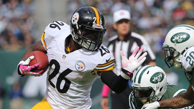 Le'Veon Bell, Pittsburgh Steelers is tackled by Kyle Wilson, New York Jets, during the New York Jets V Pittsburgh Steelers NFL regular season game at MetLife Stadium, East Rutherford, NJ, USA. 13th October 2013. Photo Tim Clayton