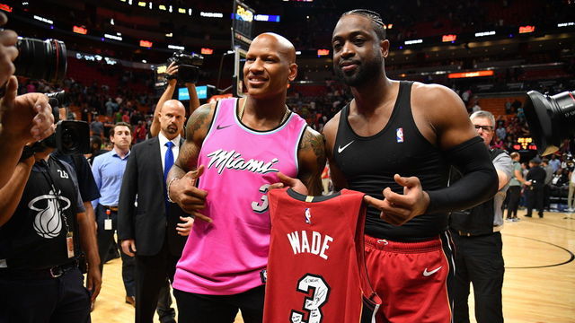 MIAMI, FL - MARCH 15: Dwyane Wade #3 of the Miami Heat gives a jersey to Pittsburgh Steeler Ryan Shazier after the game between the Miami Heat and the Milwaukee Bucks at American Airlines Arena on March 15, 2019 in Miami, Florida.