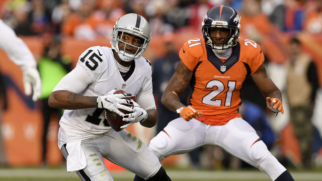 DENVER, CO - JANUARY 01: Michael Crabtree (15) of the Oakland Raiders makes a catch as Aqib Talib (21) of the Denver Broncos defends during the second quarter on Sunday, January 1, 2017. The Denver Broncos hosted the Oakland Raiders.