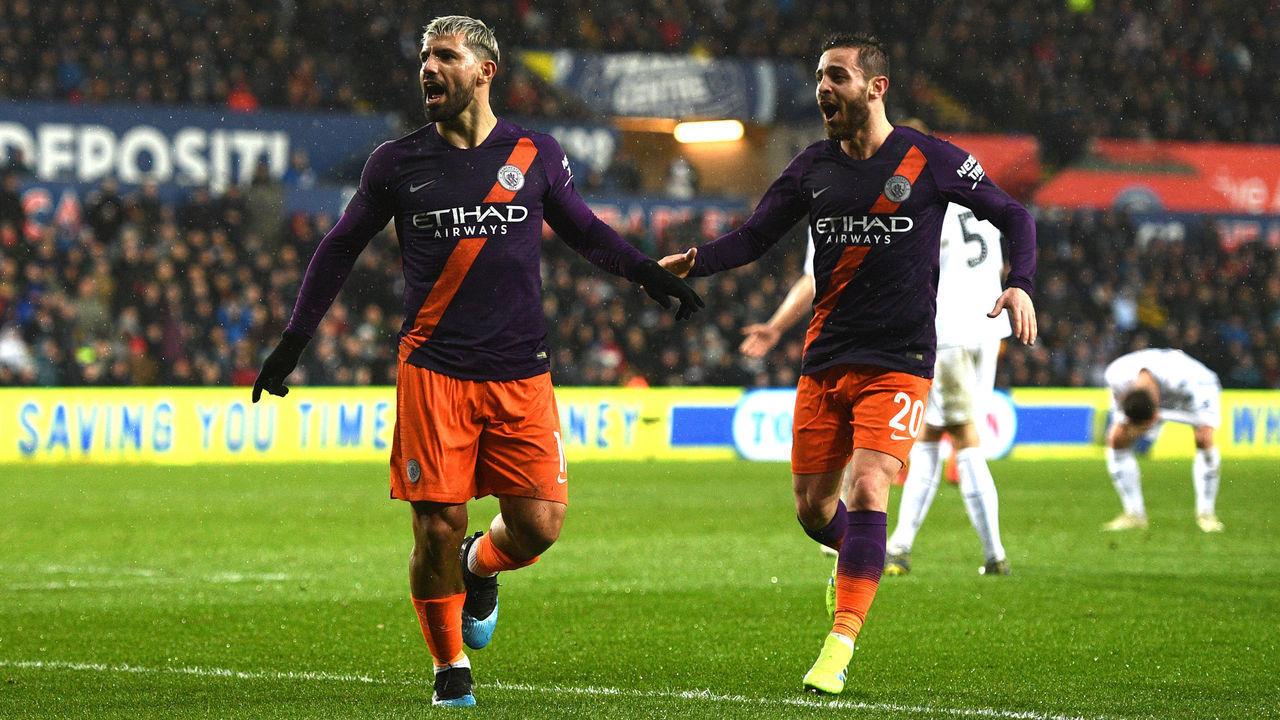 SWANSEA, WALES - MARCH 16: Sergio Aguero of Manchester City celebrates after scoring his team's third goal with Bernardo Silva of Manchester City during the FA Cup Quarter Final match between Swansea City and Manchester City at Liberty Stadium on March 16, 2019 in Swansea, United Kingdom.