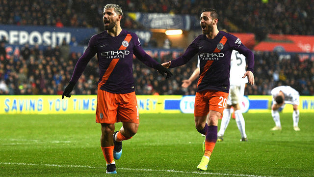 SWANSEA, WALES - MARCH 16: Sergio Aguero of Manchester City celebrates after scoring his team's third goal with Bernardo Silva of Manchester City during the FA Cup Quarter Final match between Swansea City and Manchester City at Liberty Stadium on March 16, 2019 in Swansea, United Kingdom.
