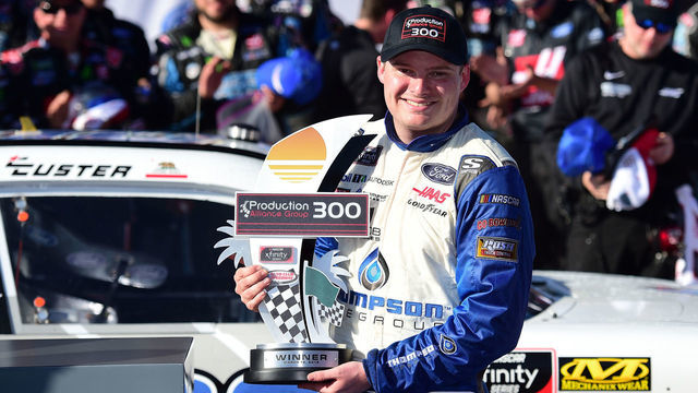 FONTANA, CA - MARCH 16: Cole Custer, driver of the #00 Thompson Pipe/Haas CNC Ford, poses with the trophy in Victory Lane after winning the NASCAR Xfinity Series Production Alliance Group 300 at Auto Club Speedway on March 16, 2019 in Fontana, California.