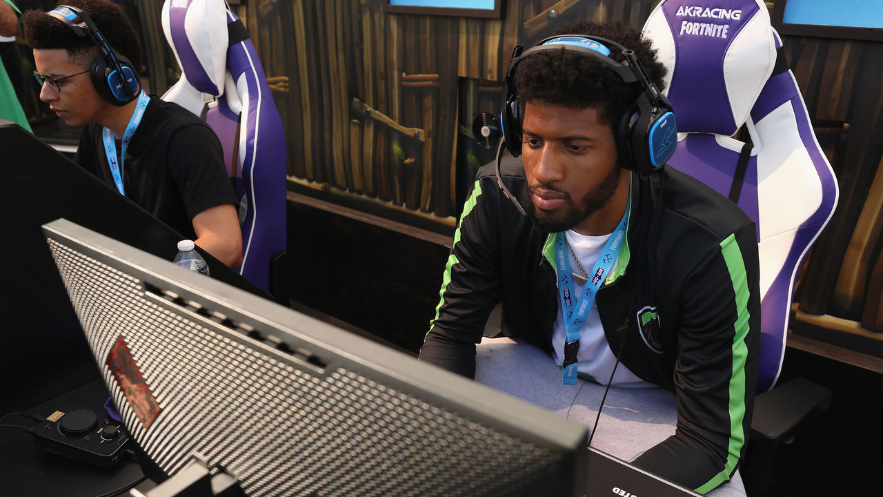 LOS ANGELES, CA - JUNE 12: NBA athlete Paul George competes in the Epic Games Fortnite E3 Tournament at the Banc of California Stadium on June 12, 2018 in Los Angeles, California.