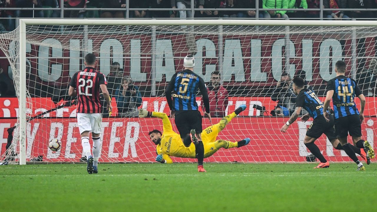 Inter Milan's Argentine forward Lautaro Martinez (2ndR) scores a penalty past AC Milan's Italian goalkeeper Gianluigi Donnarumma during the Italian Serie A football match AC Milan vs Inter Milan at the San Siro stadium in Milan.