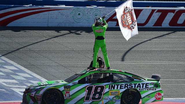 FONTANA, CA - MARCH 17: Kyle Busch, driver of the #18 Interstate Batteries Toyota, celebrates after winning the Monster Energy NASCAR Cup Series Auto Club 400 and winning his 200th NASCAR race at Auto Club Speedway on March 17, 2019 in Fontana, California.