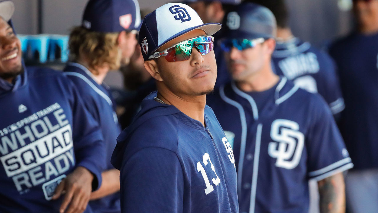PEORIA, AZ - FEBRUARY 27: San Diego Padres infielder Manny Machado (13) looks on from the dugout during the MLB spring training baseball game between the Arizona Diamondbacks and the San Diego Padres on February 27, 2019 at Peoria Sports Complex Stadium in Peoria, Arizona.