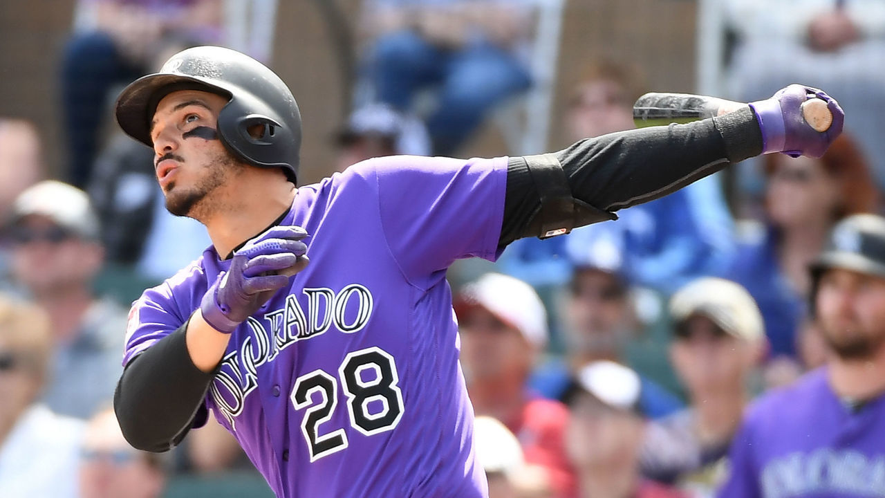 SCOTTSDALE, AZ - MARCH 15: Nolan Arenado #28 of the Colorado Rockies follows through on a swing against the Kansas City Royals during a spring training game at Salt River Fields at Talking Stick on March 15, 2019 in Scottsdale, Arizona.