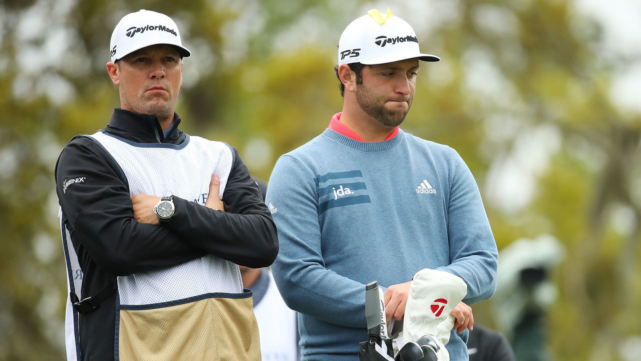 PONTE VEDRA BEACH, FLORIDA - MARCH 17: Jon Rahm of Spain and his caddie look on from the 12th tee during the final round of The PLAYERS Championship on The Stadium Course at TPC Sawgrass on March 17, 2019 in Ponte Vedra Beach, Florida.