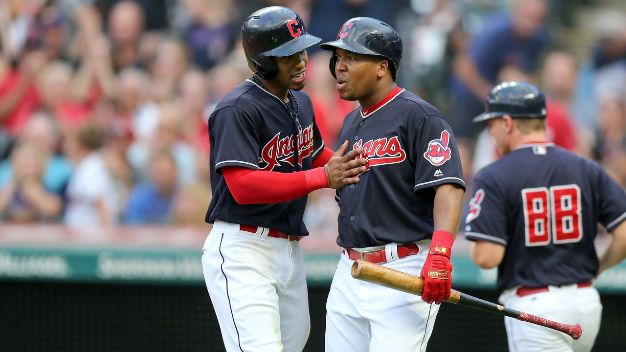 CLEVELAND, OH - AUGUST 03: Cleveland Indians shortstop Francisco Lindor (12) talks to Cleveland Indians third base Jose Ramirez (11) after scoring a run during the first inning of the Major League Baseball game between the Los Angeles Angels and Cleveland Indians on August 3, 2018, at Progressive Field in Cleveland, OH.