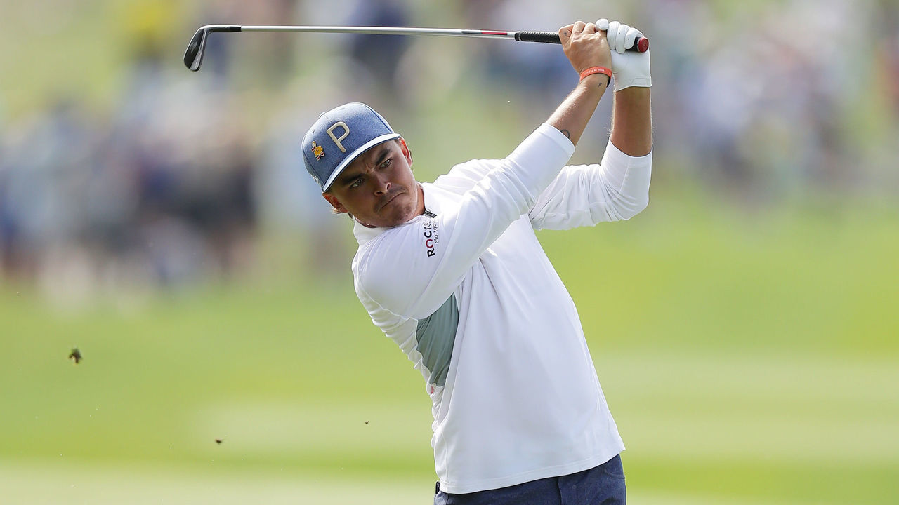 PONTE VEDRA BEACH, FLORIDA - MARCH 15: Rickie Fowler of the United States plays a shot on the 18th hole during the second round of The PLAYERS Championship on The Stadium Course at TPC Sawgrass on March 15, 2019 in Ponte Vedra Beach, Florida.