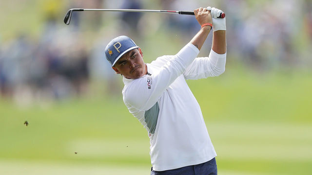 PONTE VEDRA BEACH, FLORIDA - MARCH 15: Rickie Fowler of the United States plays a shot on the 18th hole during the second round of The PLAYERS Championship on The Stadium Course at TPC Sawgrass on March 15, 2019 in Ponte Vedra Beach, Florida.