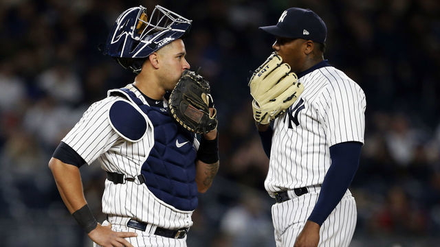 NEW YORK, NY - APRIL 6: Aroldis Chapman #54 of the New York Yankees talks to Gary Sanchez #24 of the New York Yankees against the Baltimore Orioles during the ninth inning at Yankee Stadium on April 6, 2018 in the Bronx borough of New York City.
