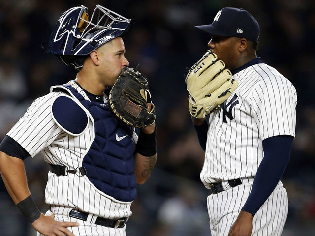NEW YORK, NY - APRIL 6: Aroldis Chapman #54 of the New York Yankees talks to Gary Sanchez #24 of the New York Yankees against the Baltimore Orioles during the ninth inning at Yankee Stadium on April 6, 2018 in the Bronx borough of New York City.