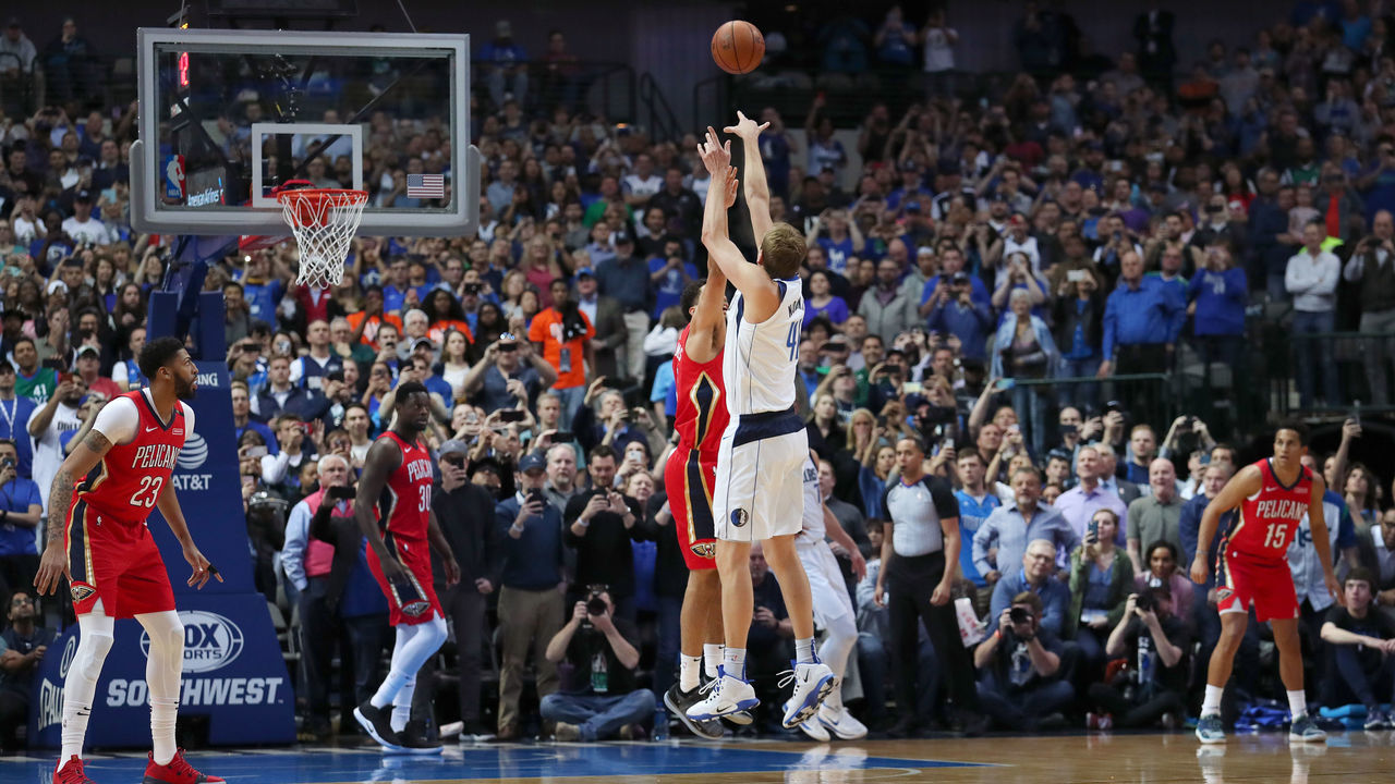 DALLAS, TEXAS - MARCH 18: Dirk Nowitzki #41 of the Dallas Mavericks scores a basket against Kenrich Williams #34 of the New Orleans Pelicans to become the sixth all-time leading scorer in the NBA at American Airlines Center on March 18, 2019 in Dallas, Texas.