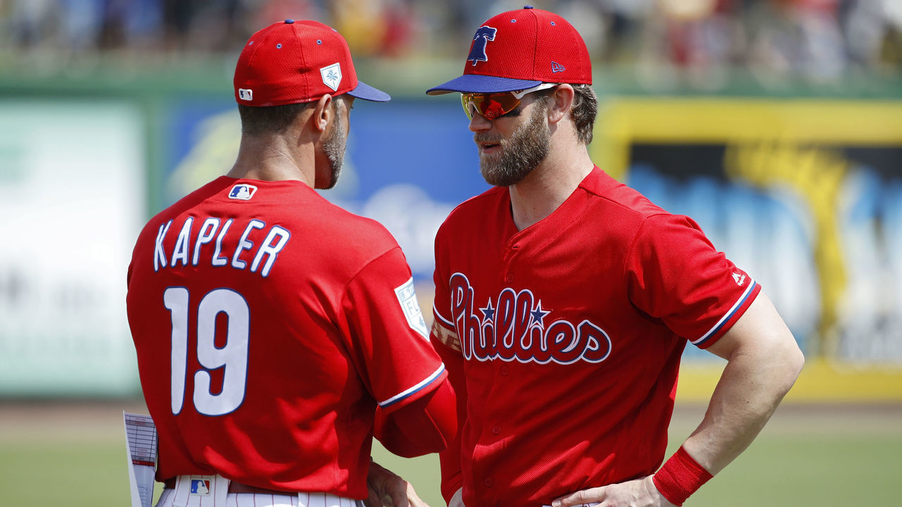 CLEARWATER, FL - MARCH 11: Bryce Harper #3 of the Philadelphia Phillies talks to manager Gabe Kapler prior to a Grapefruit League spring training game against the Tampa Bay Rays at Spectrum Field on March 11, 2019 in Clearwater, Florida. The Rays won 8-2.