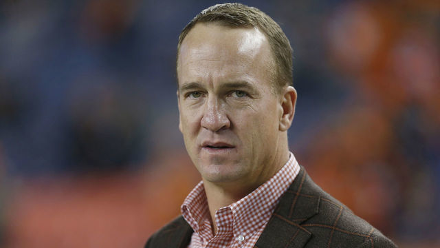 DENVER, CO - DECEMBER 15: Former Broncos quarterback, Peyton Manning stands on the sidelines prior to a game between the Denver Broncos and the visiting Cincinnati Bengals on December 15, 2018 at Sports Authority Field in Denver, CO.