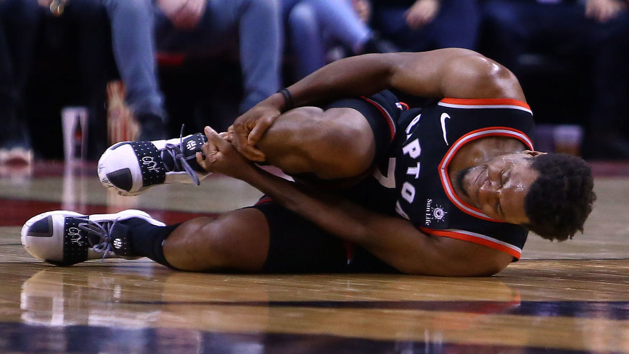TORONTO, ON - MARCH 18: Kyle Lowry #7 of the Toronto Raptors reacts after injuring his right ankle during the second half of an NBA game against the New York Knicks at Scotiabank Arena on March 18, 2019 in Toronto, Canada. Lowry left the game after the injury.