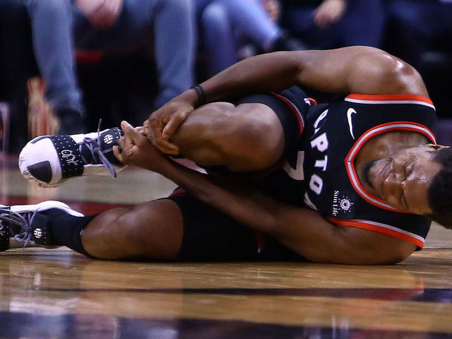 TORONTO, ON - MARCH 18: Kyle Lowry #7 of the Toronto Raptors reacts after injuring his right ankle during the second half of an NBA game against the New York Knicks at Scotiabank Arena on March 18, 2019 in Toronto, Canada. Lowry left the game after the injury.