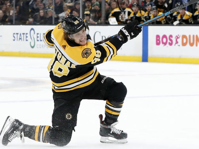 BOSTON, MA - JANUARY 17: Boston Bruins right wing David Pastrnak (88) follows through on a shot during a game between the Boston Bruins and the St. Louis Blues on January 17, 2019, at TD Garden in Boston, Massachusetts.