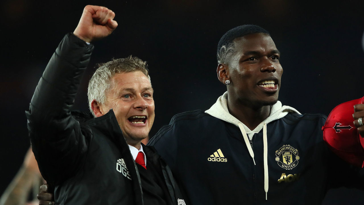 PARIS, FRANCE - MARCH 06: Manchester United Head Coach / Manager Ole Gunnar Solskjaer and Paul Pogba of Manchester United celebrate at the end of the UEFA Champions League Round of 16 Second Leg match between Paris Saint-Germain and Manchester United at Parc des Princes on March 6, 2019 in Paris, France.