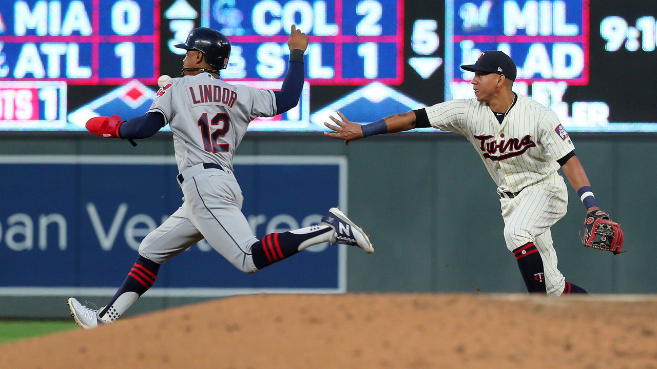 MINNEAPOLIS, MN - JULY 31: Jorge Polanco #11 of the Minnesota Twins tosses the ball to second base winning the out on Francisco Lindor #12 of the Cleveland Indians in the fourth inning at Target Field on July 31, 2018 in Minneapolis, Minnesota.
