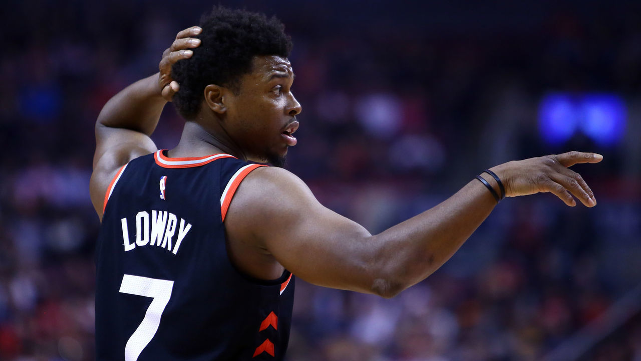 TORONTO, ON - MARCH 18: Kyle Lowry #7 of the Toronto Raptors gestures to a teammate during the first half of an NBA game against the New York Knicks at Scotiabank Arena on March 18, 2019 in Toronto, Canada.