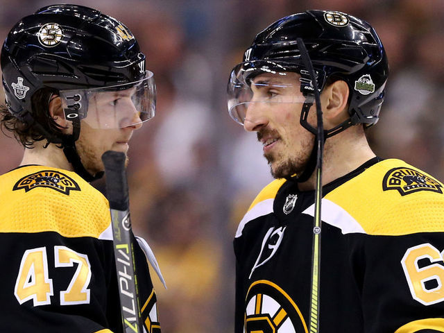 BOSTON, MA - APRIL 21: Torey Krug #47 of the Boston Bruins talks with Brad Marchand #63 during the first period of Game Five of the Eastern Conference First Round in the 2018 Stanley Cup play-offs against the Toronto Maple Leafs at TD Garden on April 21, 2018 in Boston, Massachusetts.