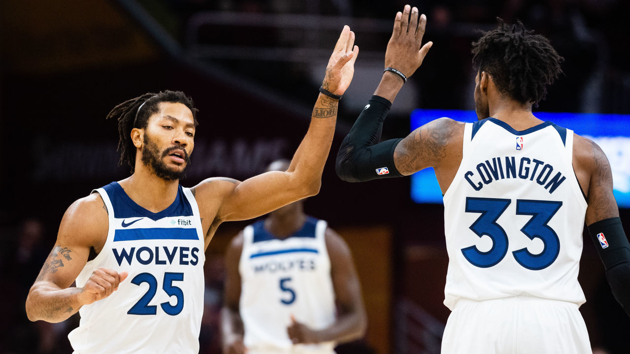 CLEVELAND, OH - NOVEMBER 26: Derrick Rose #25 celebrates with Robert Covington #33 of the Minnesota Timberwolves during the second half against the Cleveland Cavaliers at Quicken Loans Arena on November 26, 2018 in Cleveland, Ohio. The Timberwolves defeated the Cavaliers 102-95. NOTE TO USER: User expressly acknowledges and agrees that, by downloading and/or using this photograph, user is consenting to the terms and conditions of the Getty Images License Agreement.