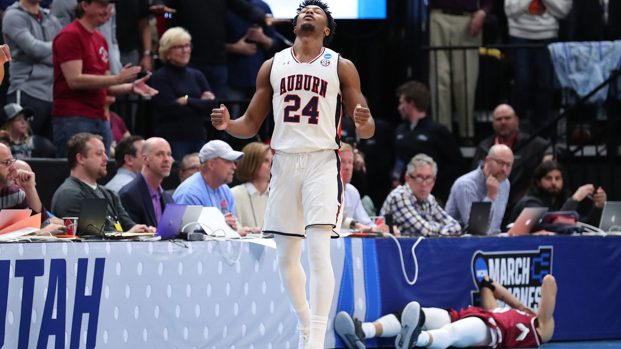 SALT LAKE CITY, UTAH - MARCH 21: Anfernee McLemore #24 of the Auburn Tigers celebrates after defeating the New Mexico State Aggies 78-77 in the first round of the 2019 NCAA Men's Basketball Tournament at Vivint Smart Home Arena on March 21, 2019 in Salt Lake City, Utah.