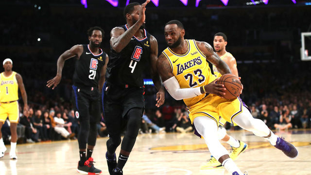 LOS ANGELES, CALIFORNIA - MARCH 04: LeBron James #23 of the Los Angeles Lakers dribbles past JaMychal Green #4 of the Los Angeles Clippers during the second half of a game against the Los Angeles Clippers at Staples Center on March 04, 2019 in Los Angeles, California. The Los Angeles Clippers defeated the Los Angeles Lakers 113-105.