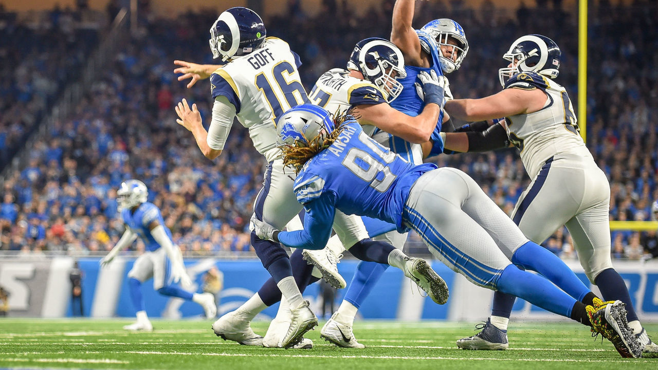 DETROIT, MI - DECEMBER 02: Los Angeles Rams quarterback Jared Goff (16) is pressured by Detroit Lions defensive end Ezekiel Ansah (94) and Detroit Lions defensive tackle Damon Harrison (98) while just barely getting the pass away during the Detroit Lions versus Los Angeles Rams game on Sunday December 2, 2018 at Ford Field in Detroit, MI.